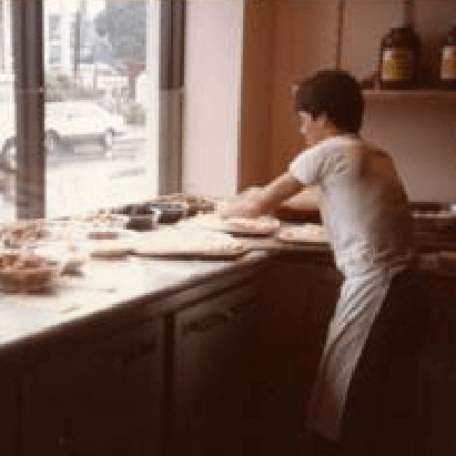 A young Joey Crugnale making pizza