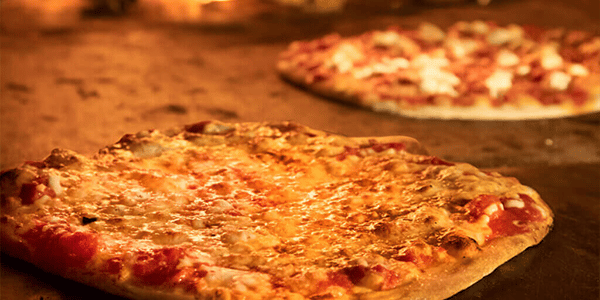 An image of two Bertucci's cheese pizzas