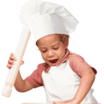 An image of a kid making pizza as a Little Chef