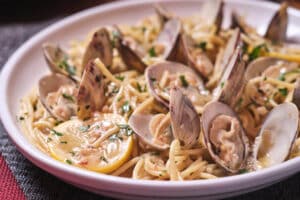 A bowl of Bertucci's Spaghetti and Clams with white wine sauce, garlic & fresh herbs