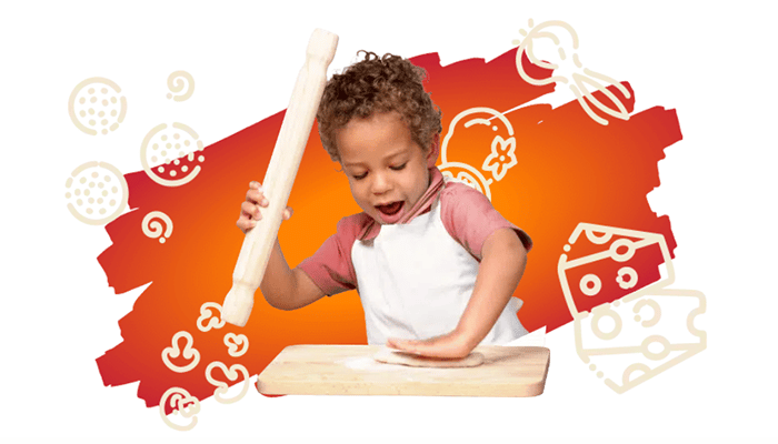 A kid making his own pizza during a Little Chef's Pizza Party
