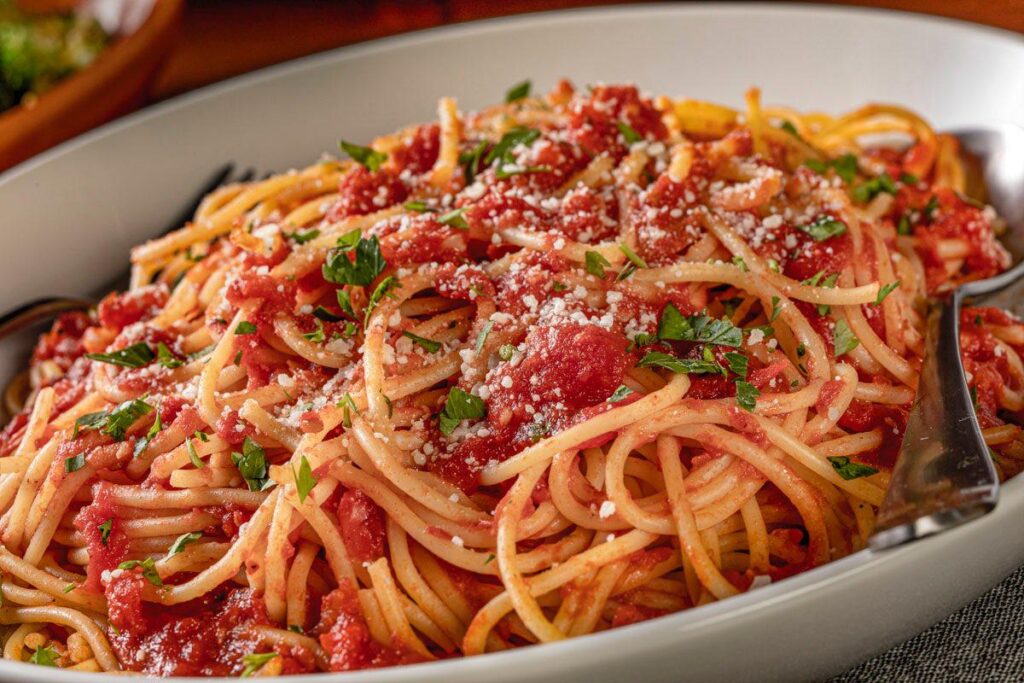 Closeup bowl of Bertucci's Spaghetti Pomodoro topped with parmesan cheese
