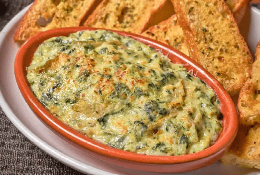 A plate of Bertucci's Spinach and Artichoke Dip with artisan flatbread