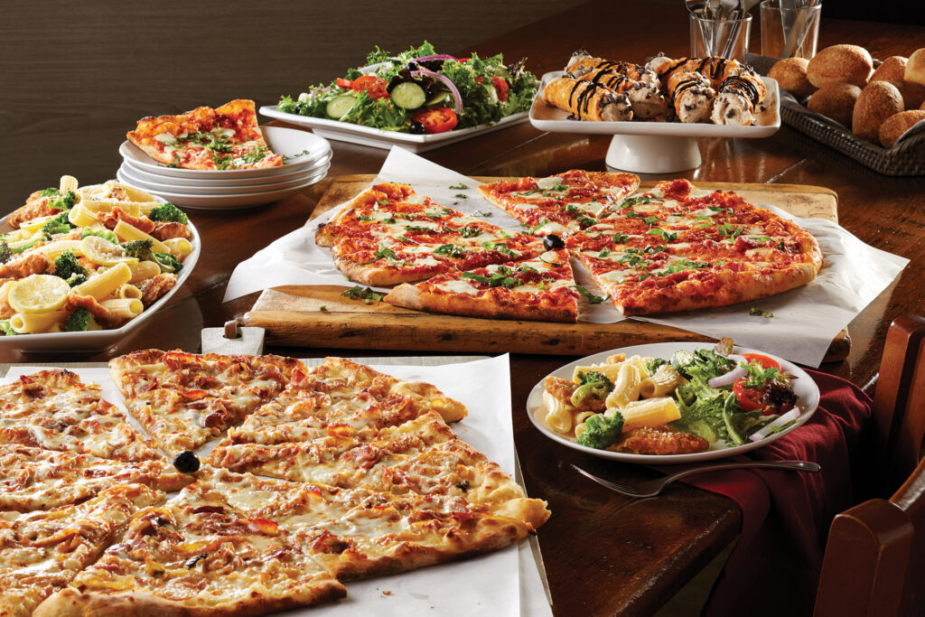 A spread of pizzas and pastas baked in the brick oven at Bertucci's