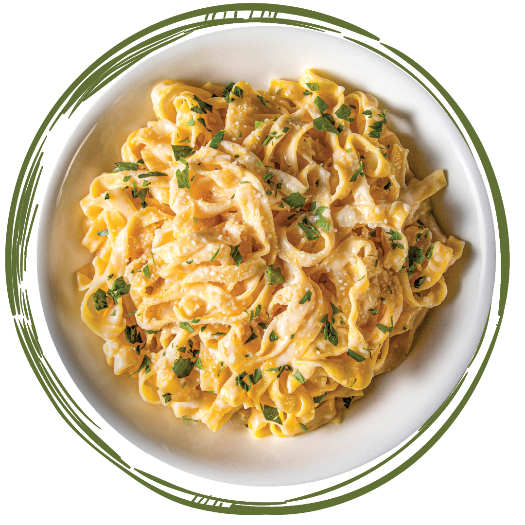 Fettuccine Alfredo from above on a plate with green lines drawn around it