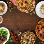Pizza and entree's on a table from above