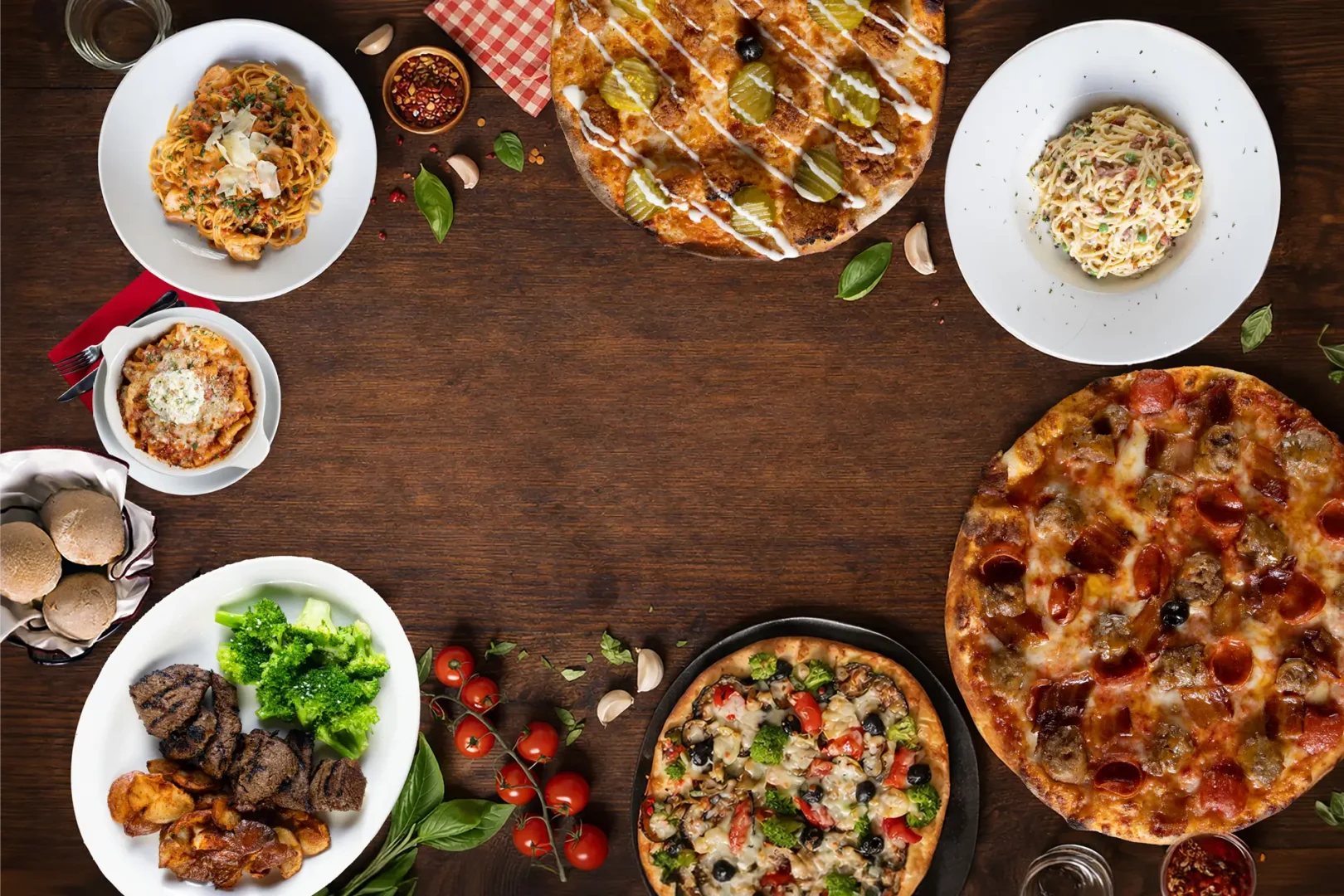 Pizza and entree's on a table from above
